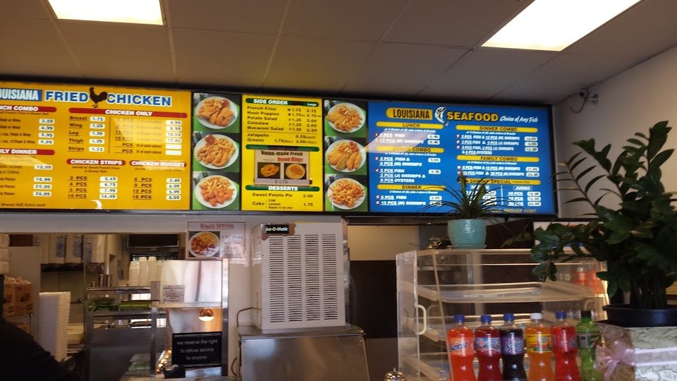 Printed menu with fish, chicken, and sides.